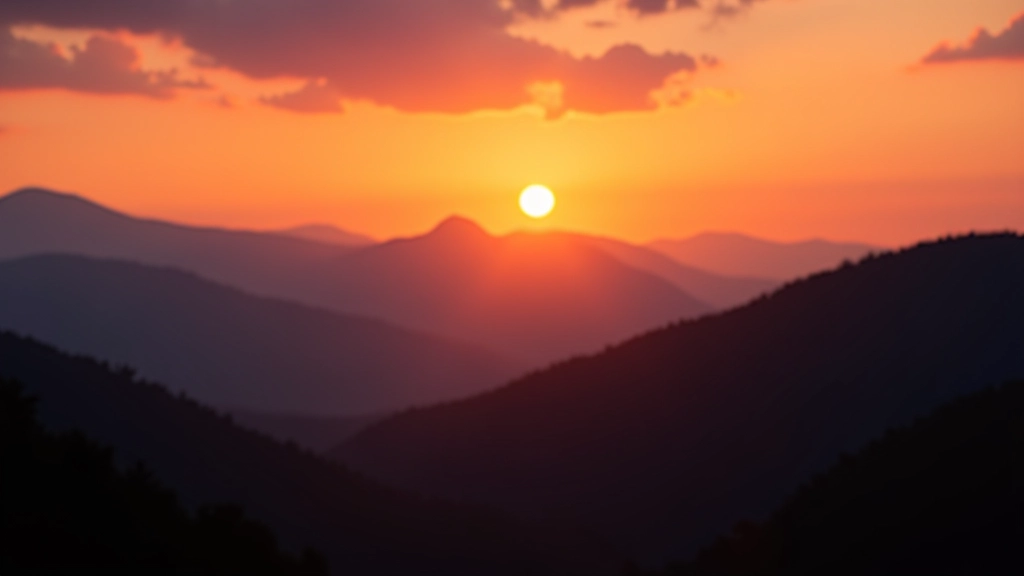 Golden hour landscape with dramatic mountain silhouettes and warm orange sky